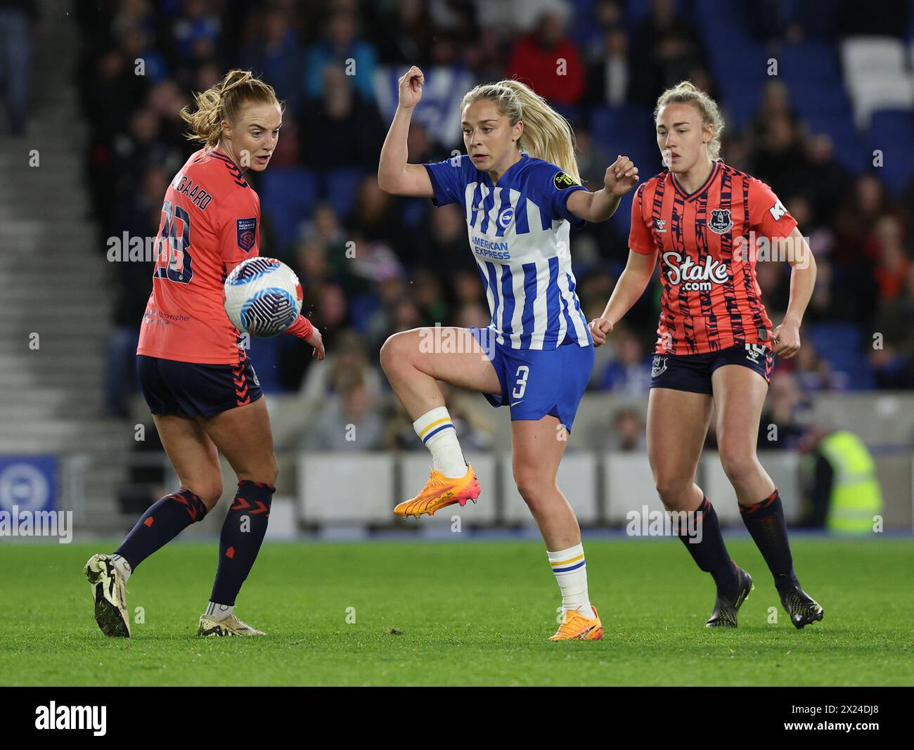 Brighton, UK. 19th Apr, 2024. Brighton's Poppy Pattinson (Centre)challenges Everton's Karen Holmgaard (L) during the Women's Super League match between Brighton & Hove `Albion and Everton at the American Express Stadium. Credit: James Boardman/Alamy Live News Stock Photo